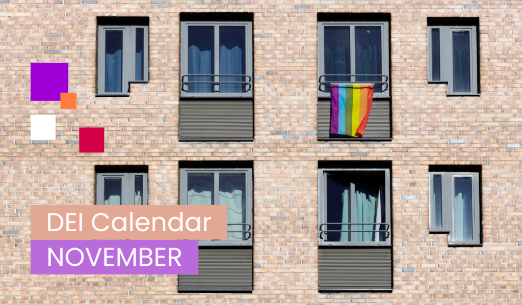 A brick building with windows, one of which is decorated with a rainbow flag symbolizing support for the LGBTQ+ community.